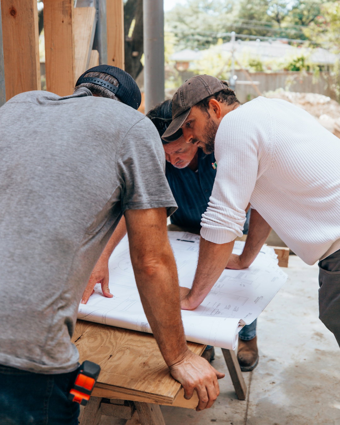 a-group-of-men-working-on-a-project.jpg a group of men working on a project